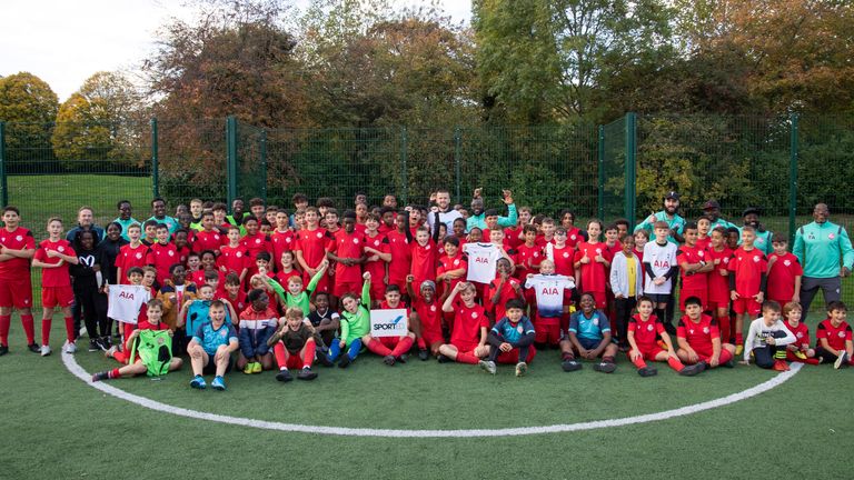 Eric Dier with children at Rap-Aid Youth Football Club (credit: Sported)