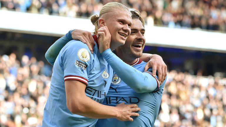 Manchester City's Erling Haaland celebrates with his team-mate Jack Grealish after scoring his side's fifth goal