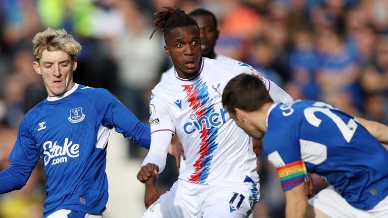 Wilfried Zaha battles for possession with Anthony Gordon and Seamus Coleman 