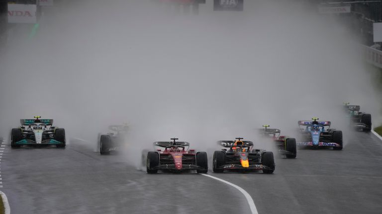 Red Bull driver Max Verstappen, center right, of the Netherlands, and Ferrari driver Charles Leclerc, of Monaco, lead the field shortly after the start of the Japanese Formula One Grand Prix at the Suzuka Circuit in Suzuka, central Japan, Sunday, Oct. 9, 2022. (AP Photo/Eugene Hoshiko)