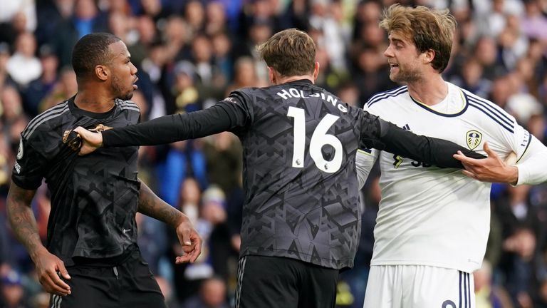 Gabriel and Patrick Bamford are separated by Arsenal's Rob Holding after clashing