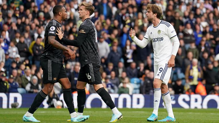 Gabriel is held back by Rob Holding after clashing with Patrick Bamford