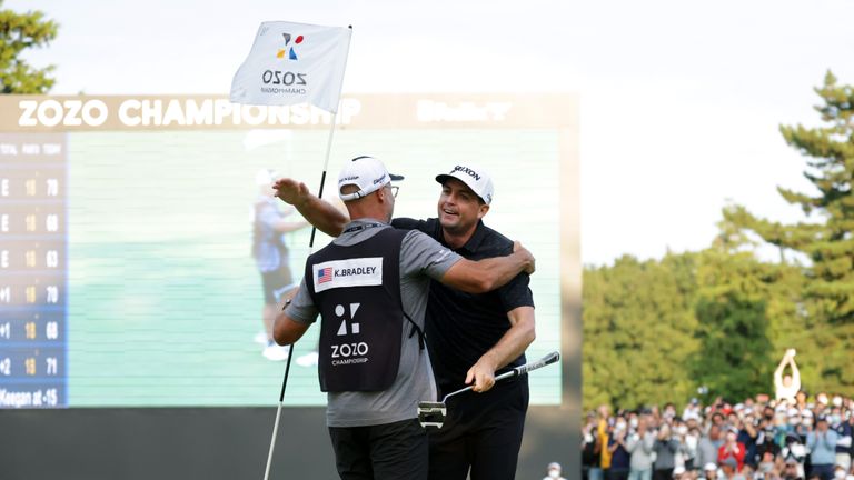INZAI, JAPAN - OCTOBER 16: Keegan Bradley (R) of the United States celebrates winning the tournament with his caddie on the 18th green during the final round of the ZOZO Championship at Accordia Golf Narashino Country Club on October 16, 2022 in Inzai, Chiba, Japan. (Photo by Chung Sung-Jun/Getty Images)