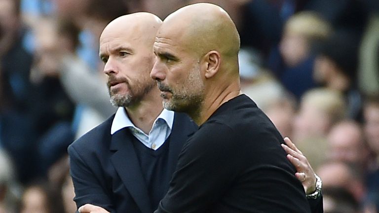 Manchester City&#39;s head coach Pep Guardiola, right, cheers with Manchester United&#39;s head coach Erik ten Hag at the end of the English Premier League soccer match between Manchester City and Manchester United at Etihad stadium in Manchester, England, Sunday, Oct. 2, 2022. 