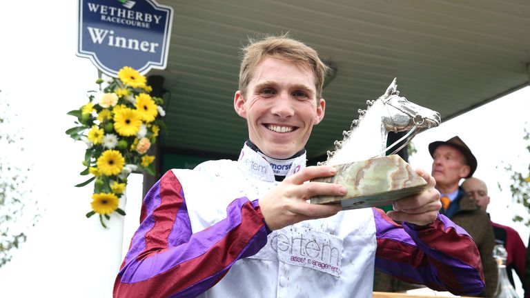 Harry Cobden celebrates after winning the Charlie Hall Chase at Wetherby with Bravemansgame