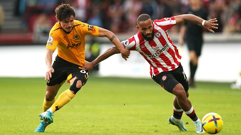 Wolverhampton Wanderers' Hugo Bueno (left) and Brentford's Bryan Mbeumo battle for the ball