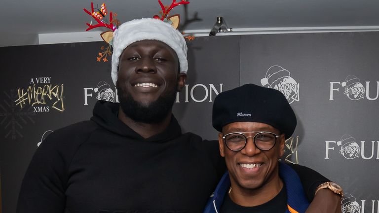 Stormzy with former Arsenal footballer Ian Wright during A Very Merky Christmas, the first ever Christmas party held by Stormzy&#39;s charity, Merky Foundation, which is being held at Fairfield Halls in his hometown of Croydon, with free tickets available for people who live in the south London borough. Picture date: Friday December 3, 2021.