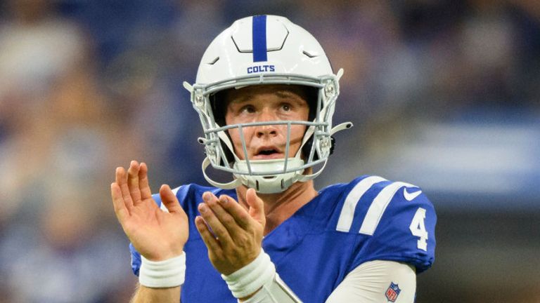 Indianapolis Colts quarterback Sam Ehlinger (4) watches a video replay on the field during an NFL football game against the Tampa Bay Buccaneers, Saturday, Aug. 27, 2022, in Indianapolis. (AP Photo/Zach Bolinger)