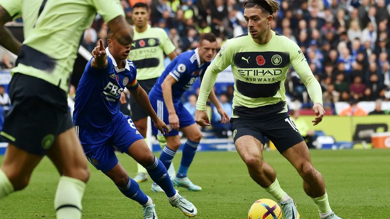 Manchester City's Jack Grealish is challenged by Youri Tielemans