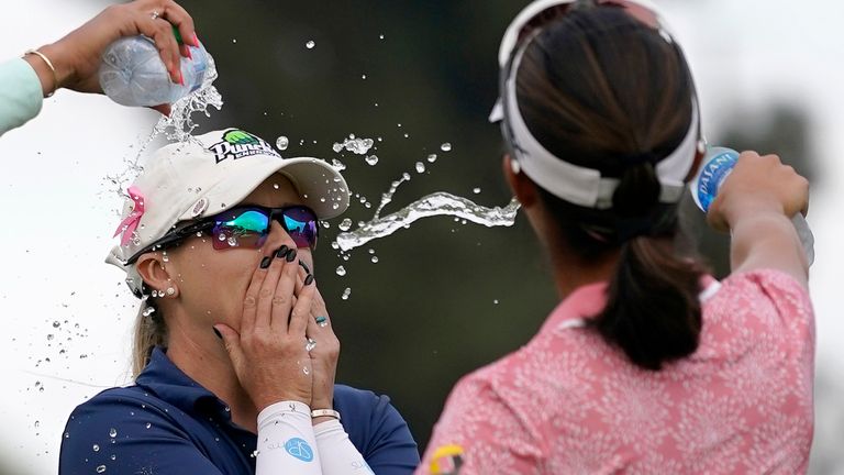 Jodi Ewart Shadoff, center, of England, is doused with water by Paula Reto, left, and Andrea Lee after winning during the MEDIHEAL Championship golf tournament Sunday, Oct. 9, 2022, in Camarillo, Calif. (AP Photo/Mark J. Terrill) 