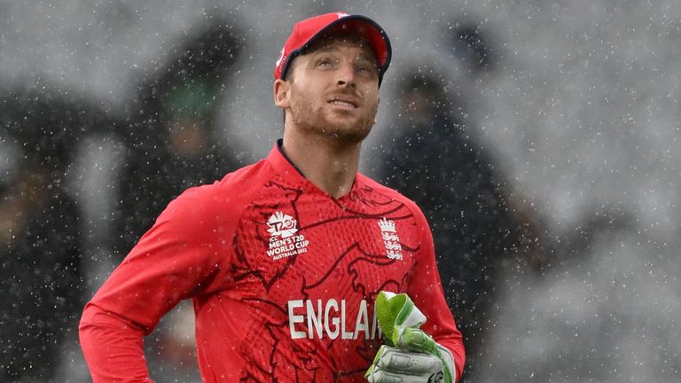 England's Captain Jos Buttler runs off the field as rain delays play during the ICC men's Twenty20 World Cup 2022 cricket match between England and Ireland at Melbourne Cricket Ground (MCG) on October 26, 2022 in Melbourne.