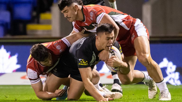 New Zealand's Joseph Manu is tackled by Lebanon's James Roumanos & Brandon Morkos - New Zealand Kiwis v Lebanon Men, Round 1 of the Rugby League World Cup England 2021 (played in 2022) at Halliwell Jones Stadium, Warrington, England on Sunday 16 October 2022... Mandatory credit: Allan McKenzie / www.photosport.nz