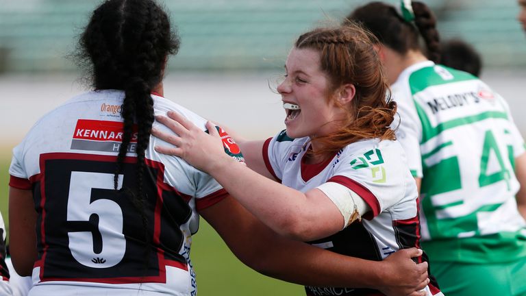 Kate Williams celebrates a try with North Harbour team-mate Seremia Tavaga