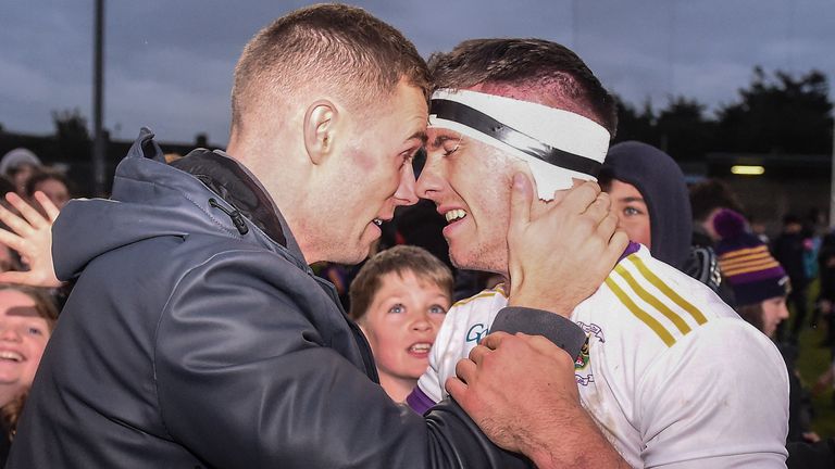 16 October 2022; Injured Kilmacud Crokes' player Paul Mannion celebrates, with team-mate Shane Walsh after the Dublin County Senior Club Championship Football Final match between Kilmacud Crokes and Na Fianna at Parnell Park in Dublin. Photo by Daire Brennan/Sportsfile