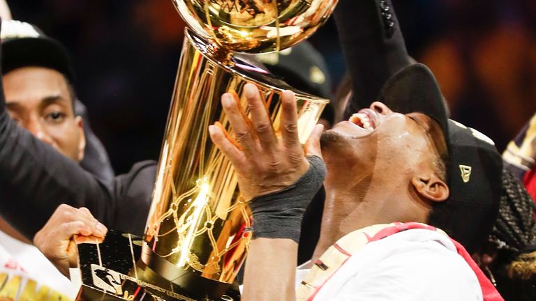 Kyle Lowry smiles as he holds the Larry O&#39;Brien NBA Championship Trophy aloft in 2019 – many Toronto Raptors fans still have a massive soft spot for him