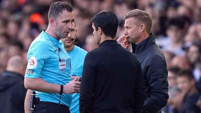 Both managers are spoken to as play is suspended due to a power cut