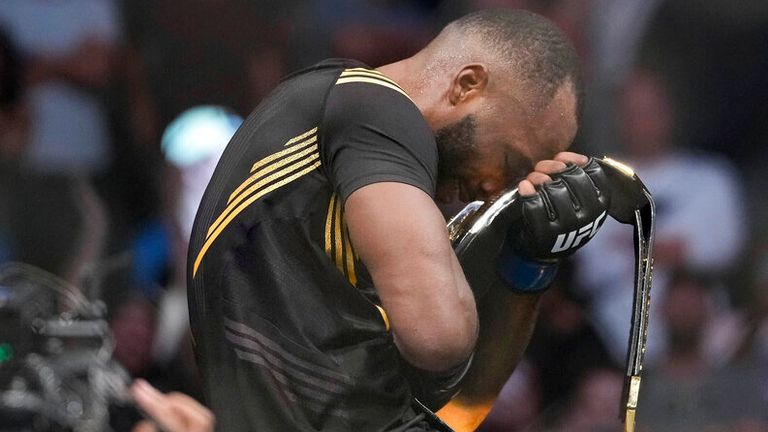 UFC fighter Leon Edwards, of Jamaica, celebrates his title as welterweight champion of the world after knocking out Nigerian UFC fighter Kamaru Usman during the UFC 278 mixed martial arts title bout in Salt Lake City on Saturday, Aug. 20, 2022. (Francisco Kjolseth/The Salt Lake Tribune via AP)