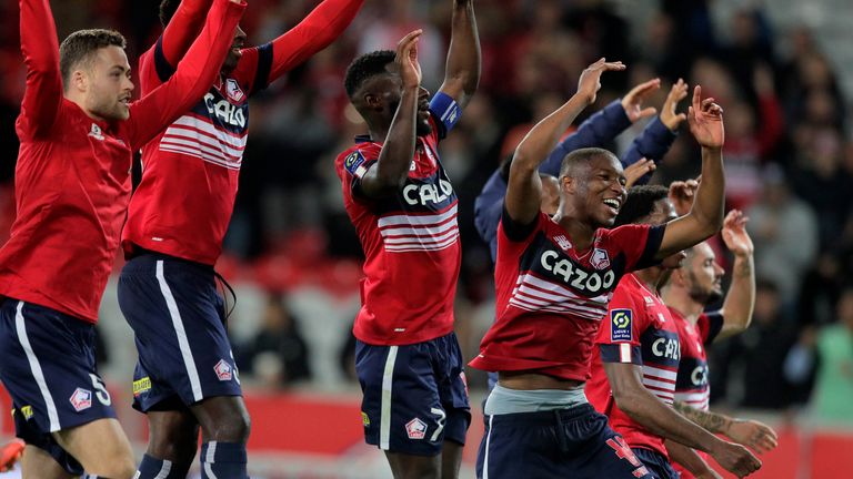 Lille players celebrate after beating Monaco