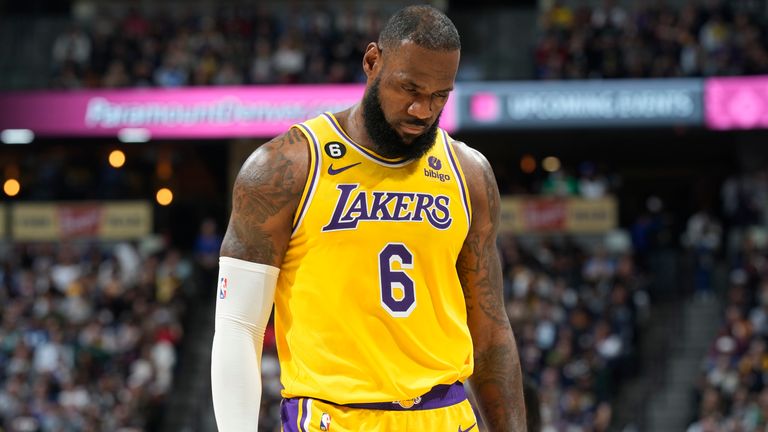 Los Angeles Lakers forward LeBron James heads to the bench looking dejected in the second half of Wednesday night&#39;s game against the Denver Nuggets