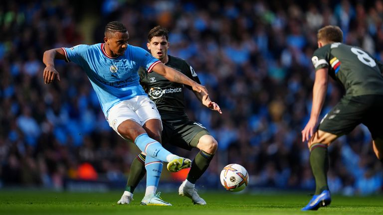Manchester City's Manuel Akanji, left, and Southampton's Romain Perraud challenge for the ball during the English Premier League soccer match between Manchester City and Southampton at the Etihad Stadium in Manchester, England on Saturday, October 8, 2022 (AP Photo/Jon Super)