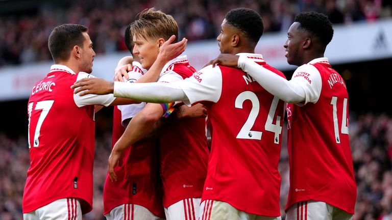 Arsenal's Martin Odegaard (centre) celebrates with his team-mates