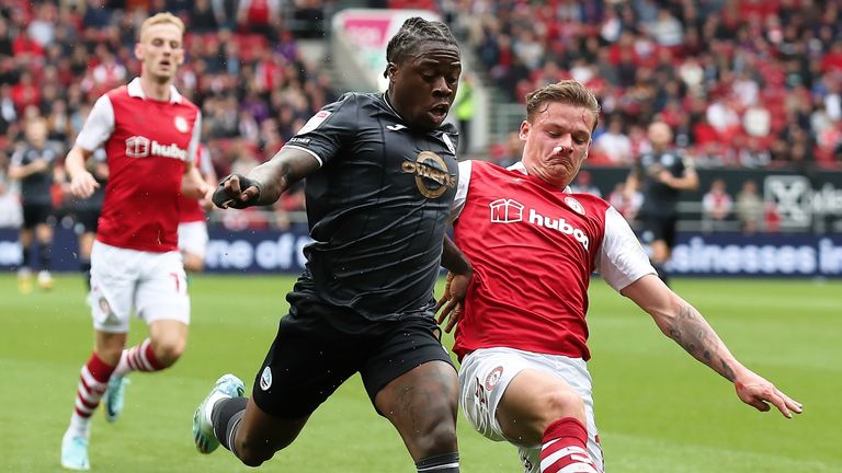 Michael Obafemi is challenged by Cameron Pring
