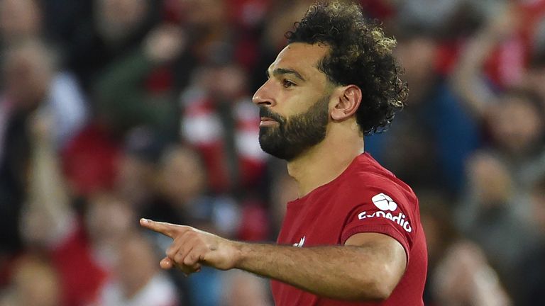 Mohamed Salah celebrates after scoring Liverpool's second goal from the spot vs Rangers