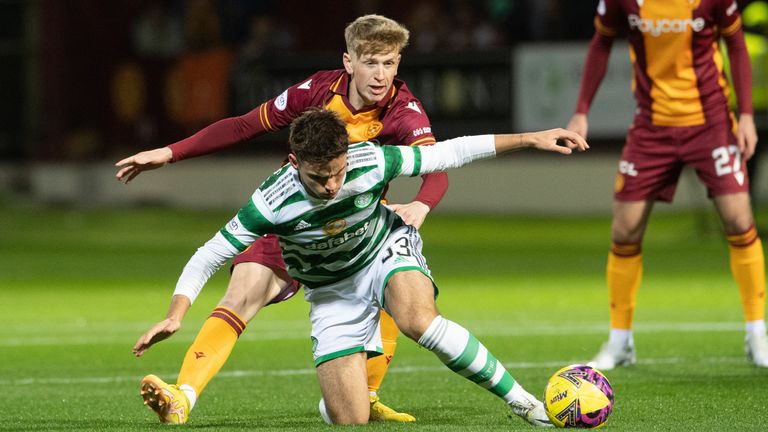 Motherwell&#39;s Stuart McKinstry and Celtic&#39;s Matt O&#39;Riley battle for the ball