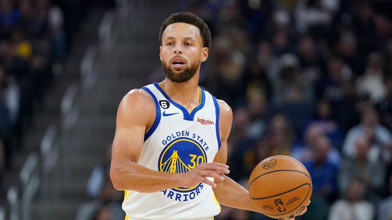 Golden State Warriors guard Stephen Curry brings the ball up the court against the Miami Heat during the first half of an NBA basketball game in San Francisco, Thursday, Oct. 27, 2022. (AP Photo/Jeff Chiu)



