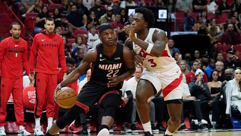 Miami Heat forward Jimmy Butler (22) drives to the basket as Toronto Raptors forward O.G. Anunoby (3) defends during the second half of an NBA basketball game Saturday, Oct. 22, 2022, in Miami. (AP Photo/Marta Lavandier)


