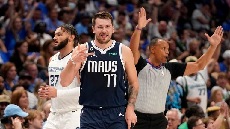 Dallas Mavericks guard Luka Doncic (77) celebrates sinking a 3-point basket, while Memphis Grizzlies guard David Roddy (27) walks past during the first half of an NBA basketball game in Dallas, Saturday, Oct. 22, 2022. (AP Photo/Tony Gutierrez)



