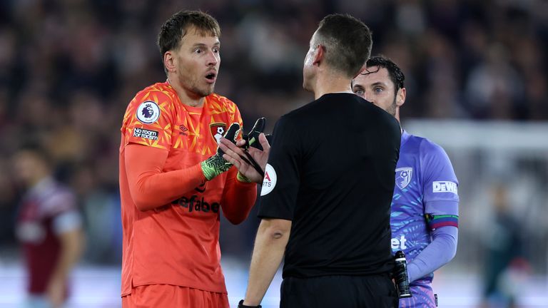 Bournemouth goalkeeper Neto argues with the referee