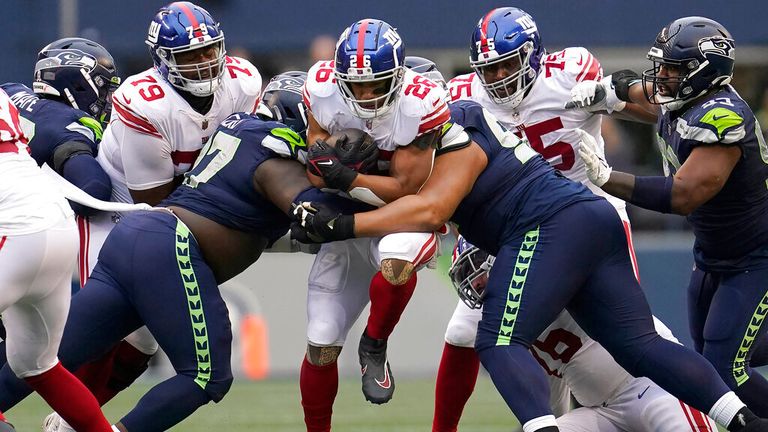 New York Giants running back Saquon Barkley (26) runs against the Seattle Seahawks during the second half of an NFL football game in Seattle, Sunday, Oct. 30, 2022. (AP Photo/Marcio Jose Sanchez)