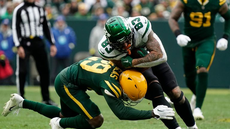 Green Bay Packers cornerback Rasul Douglas (29) stops New York Jets tight end Tyler Conklin (83) after a catch during the second half of an NFL football game Sunday, Oct. 16, 2022, in Green Bay, Wis. (AP Photo/Morry Gash)


