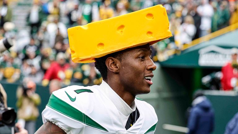 New York Jets cornerback Sauce Gardner (1) wears a cheesehead as he reacts after beating the Green Bay Packers during an NFL game Sunday, Oct. 16, 2022, in Green Bay, Wis. (AP Photo/Jeffrey Phelps)