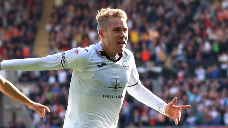 Ollie Cooper celebrates after opening the scoring for Swansea against Cardiff