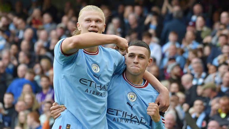 Phil Foden celebrates with Erling Haaland after scoring Man City&#39;s sixth goal. Both players scored hat tricks in the derby win over Man Utd