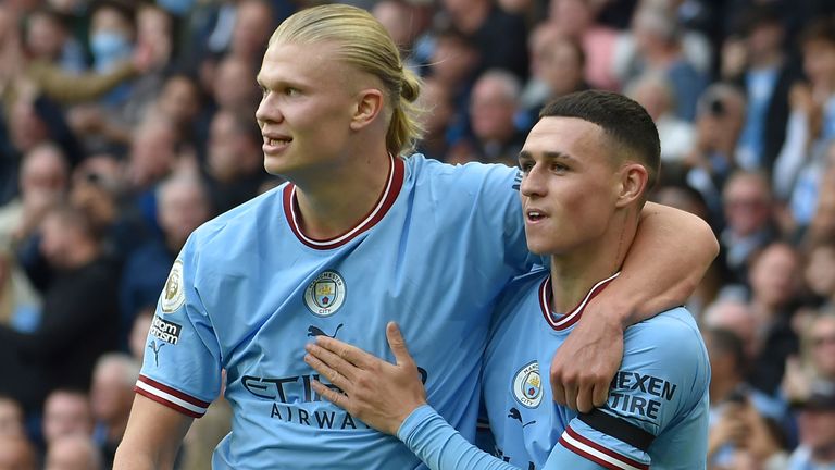 Phil Foden celebrates with Erling Haaland after scoring Man City's sixth goal. Both players scored hat tricks in the derby win over Man Utd