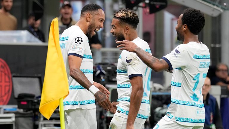 Chelsea's Pierre-Emerick Aubameyang celebrates with Reece James and Raheem Sterling after scoring against AC Milan in Champions League