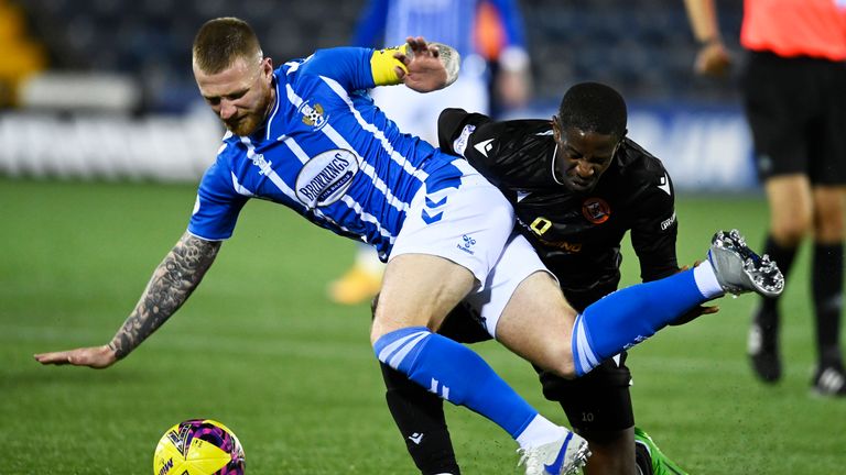 KILMARNOCK, SCOTLAND - OCTOBER 18: Alan Power and Arnaud Djoum  in action during a Premier Sports Cup match between Kilmarnock and Dundee United at Rugby Park, on October 18, 2022, in Kilmarnock, Scotland. (Photo by Rob Casey / SNS Group)