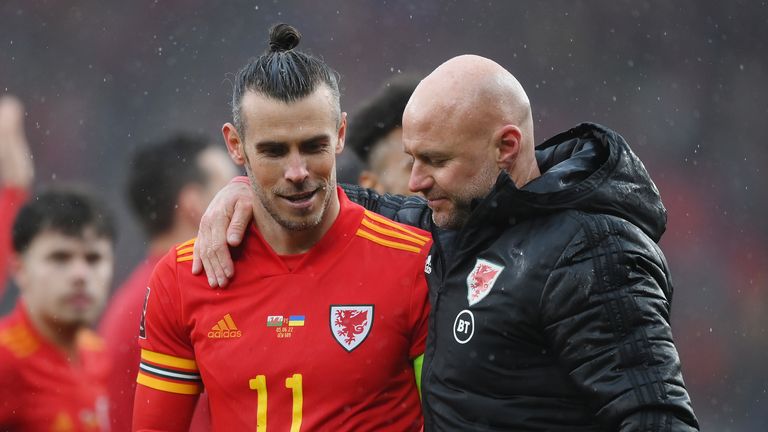 CARDIFF, WALES - JUNE 05: Gareth Bale celebrates with Rob Page, Wales head coach, after their teams' victory qualifying Wales for the 2022 FIFA World Cup during the FIFA World Cup qualifier between Wales and Ukraine at Cardiff City 5 Stadium June 2022 in Cardiff, Wales.  (Photo by Sean Botterill/Getty Images)