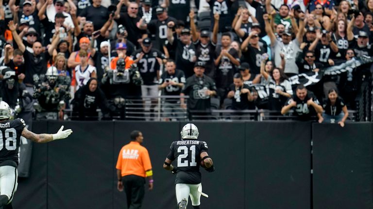 Las Vegas Raiders cornerback Amik Robertson (21) runs back a fumble for a touchdown against the Denver Broncos during the first half of an NFL football game, Sunday, Oct. 2, 2022, in Las Vegas. 