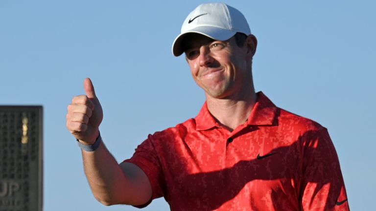 Rory McIlroy, of Northern Ireland, gestures near the tournament trophy after winning the CJ Cup golf tournament on Oct. 17, 2021, in Las Vegas. McIlroy defends his title starting Thursday, Oct. 20, 2022, when the CJ Cup moves to South Carolina. He can reach No. 1 in the world with a win. (AP Photo/David Becker, File)