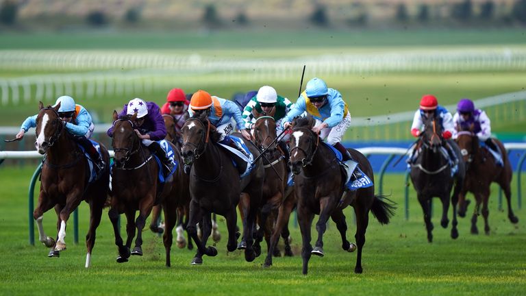 Rumstar (blue cap, right) comes through to win the Cornwallis Stakes at Chepstow