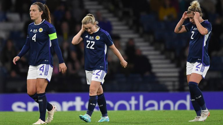 GLASGOW, SCOTLAND - OCTOBER 11: Scotland&#39;s Rachel Corsie, Erin Cuthbert and Nicola Docherty look dejected during a FIFA Women&#39;s World Cup playoff match between Scotland and Ireland at Hampden Park, on October 11, 2022, in Glasgow, Scotland. (Photo by Ross MacDonald / SNS Group)