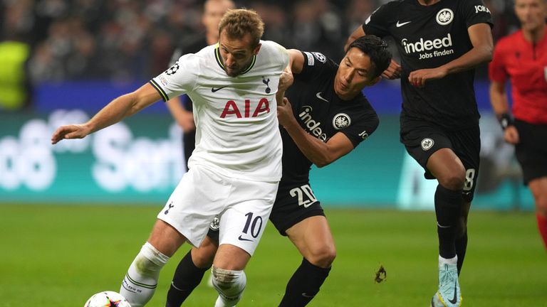 Tottenham's Harry Kane challenges for the ball with Frankfurt's Makoto Hasebe