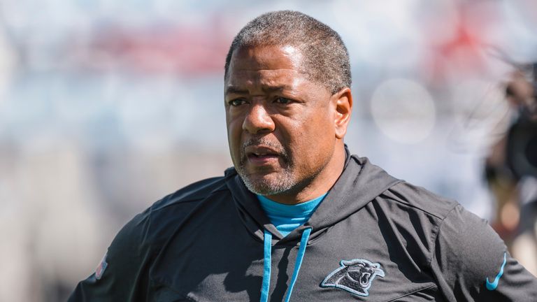 Interim Carolina Panthers head coach Steve Wilks watches warmups prior to the start of an NFL football game against he Tampa Bay buccaneers Sunday, Oct. 23, 2022, in Charlotte, N.C. (AP Photo/Jacob Kupferman)
