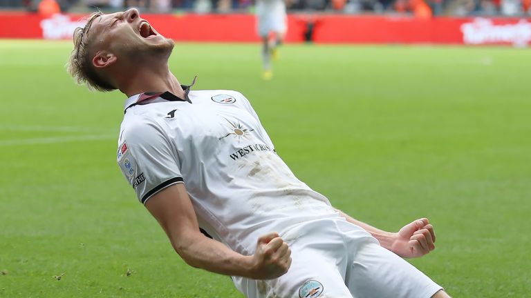 Harry Darling roars in celebration after scoring Swansea's second goal against Sunderland