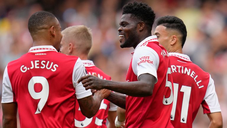 Arsenal's Thomas Partey, right, celebrates with his team-mate Arsenal's Gabriel Jesus after scoring his side's opening goal