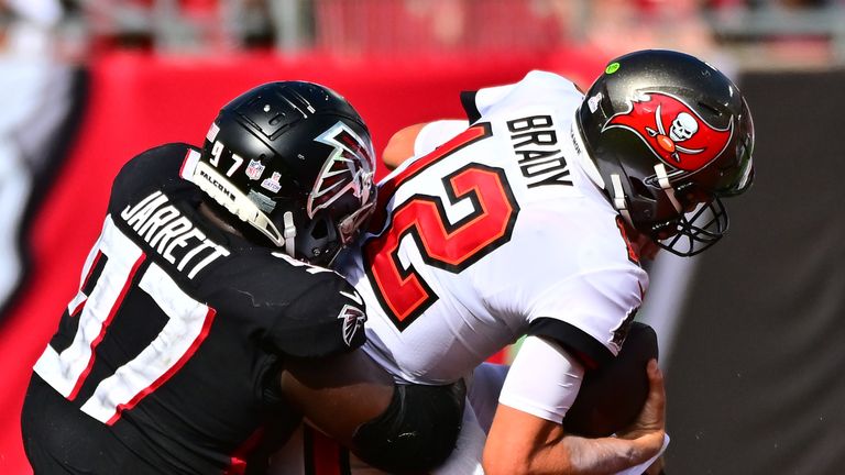 Tampa Bay Buccaneers quarterback Tom Brady is sacked by Atlanta Falcons defensive end Grady Jarrett - the play ruled as roughing the passer